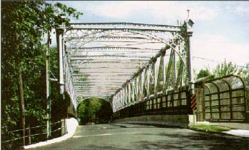 photo: bridge with historic metal bridge and pedestrian walkway