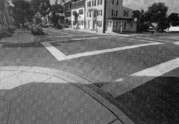 photo: four way intersection with marked crosswalks
