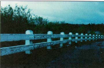 photo: steelbacked wooden guardrail
