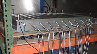 Figure 2.2.2-8 Aluminum Mold Half Showing Inserted Cartridge Heaters