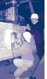 Researchers at FHWA's Turner-Fairbank Highway Research Center test a beam of high-performance concrete