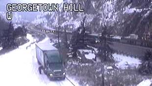 Exhibit 11- Trucker removing chains Georgetown Hill (CCTV image) 