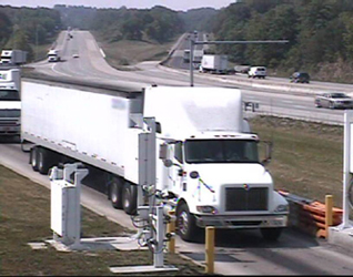 Color photograph of truck passing through the ISSES portal at Laurel County, taken from the gable-mounted overview camera system of the ISSES.