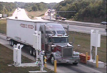 Three-part photo from overhead gable-mounted camera, illustrating how ISSES occasionally triggers the system when no truck is present.  The top photo shows the first truck. ISSES created three records when it should have created two records.