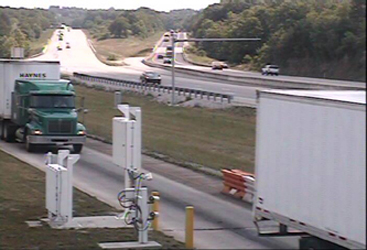 Three-part photo from overhead gable-mounted camera, illustrating how ISSES occasionally triggers the system when no truck is present.The middle photo shows a second truck approaching the ISSES.  ISSES created three records when it should have created two records.