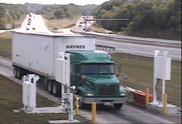 Three-part photo from overhead gable-mounted camera, illustrating how ISSES occasionally triggers the system when no truck is present.  The third photo shows the same (second) truck in the portal.  ISSES created three records when it should have created two records.
