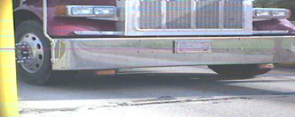 Four part image, showing images captures by automatic license plate reader cameras.  Top: wide angle view of the front bumper of a semi tractor, with no license plate number visible.