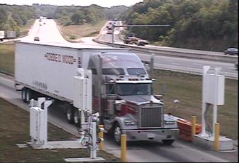 Figure 19. Photograph montage. The first of a three-part photoraph montage from overhead gable-mounted camera, illustrating how ISSES occasionally triggers the system when no truck is present. This photograph shows the first truck.